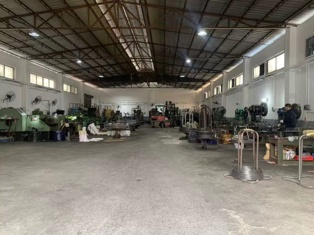 Spacious integrated production and storage workshop with material handling equipment and metalworking machinery